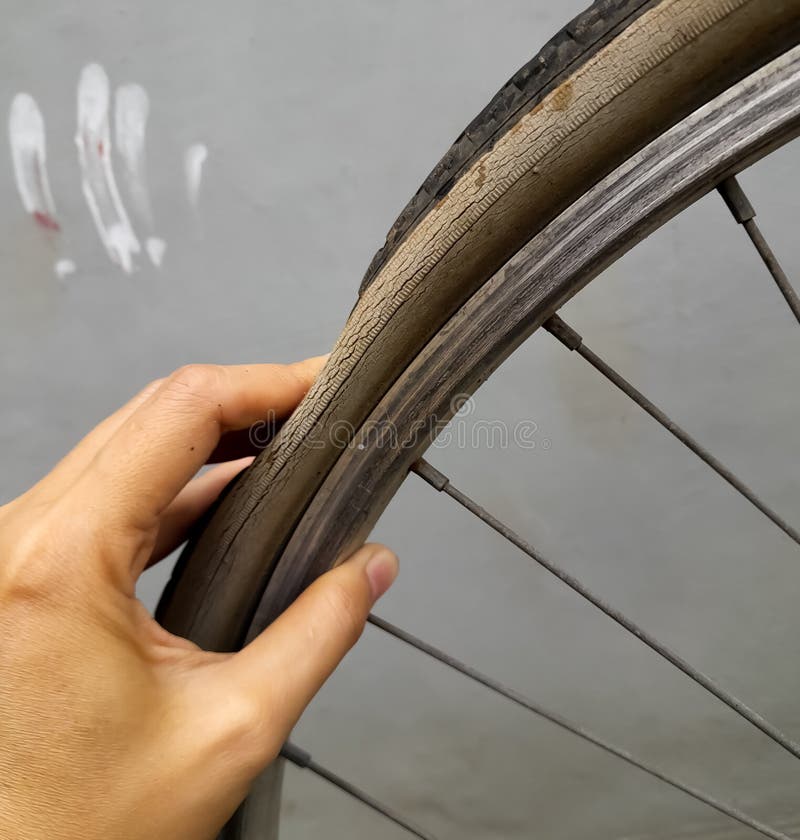 Female Hand Holding a Punctured Bicycle Tire Stock Photo Image of punctures, flat 267908866