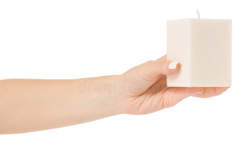 Female hand holding a white candle