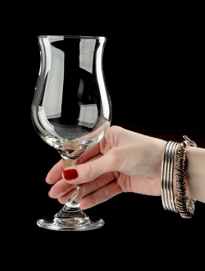Female Hand Holding Empty Wine Glass. Isolated On White Background