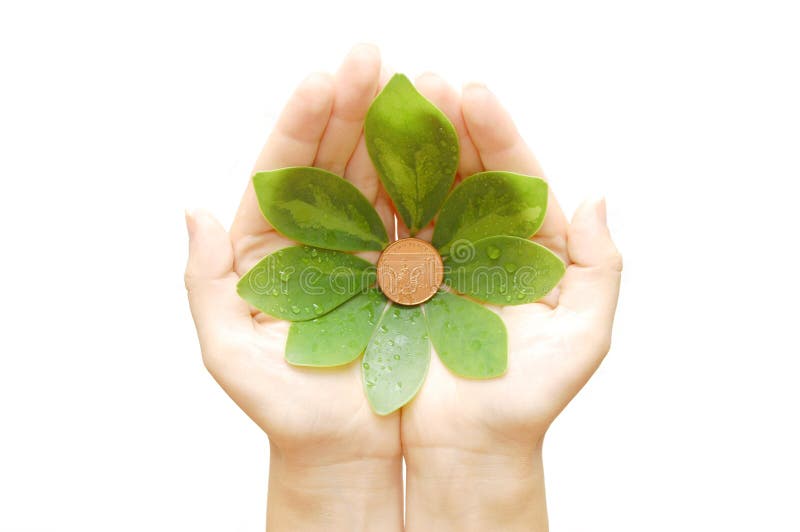 The female hand holds leaves and a coin