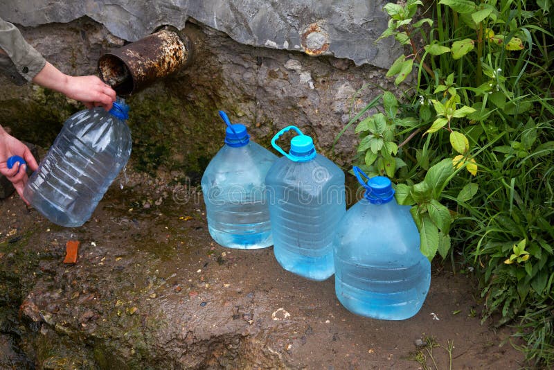 The female hand holds plastic bottle with water royalty free stock photo