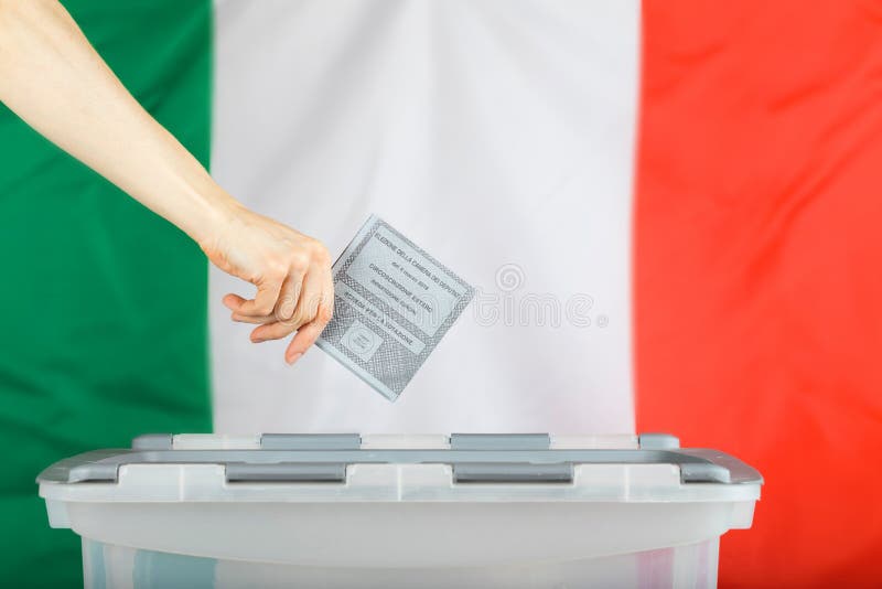 Female hand keeps ballot over ballot box. Italian flag in the ba royalty free stock photography Female hand keeps ballot over ballot box. Italian flag in the ba royalty free stock photography