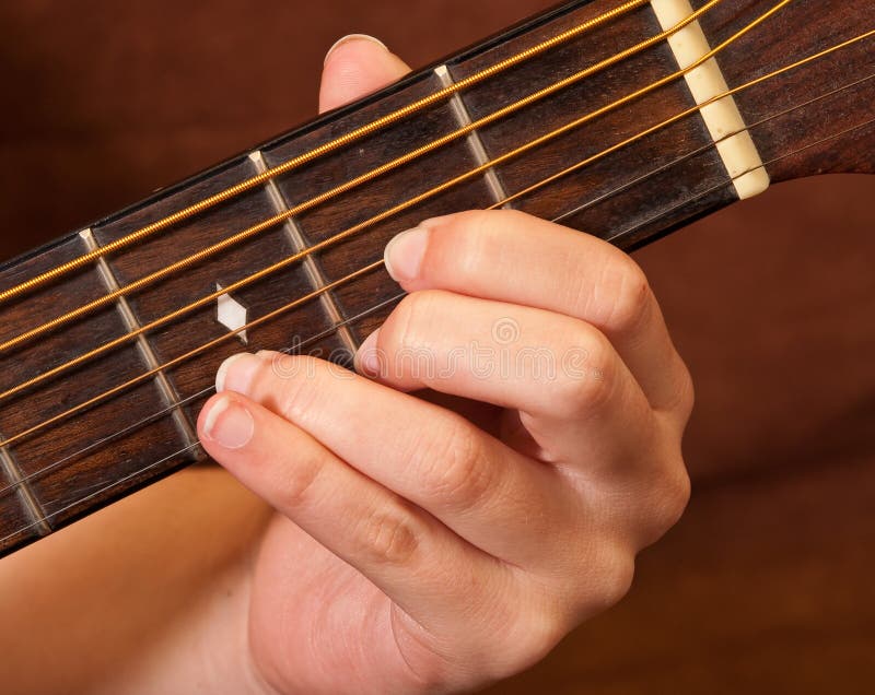 Female Hand Learning Guitar Chord