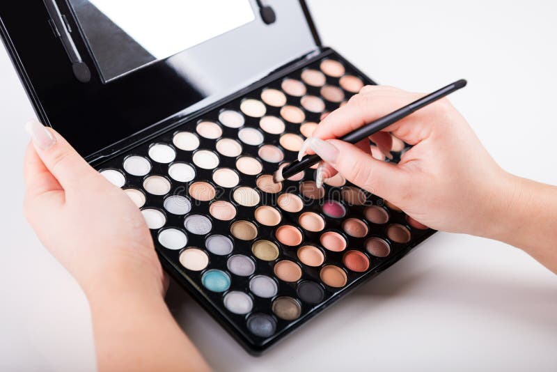 Female Hand with Makeup Brush and Paints Stock Photo Image of color