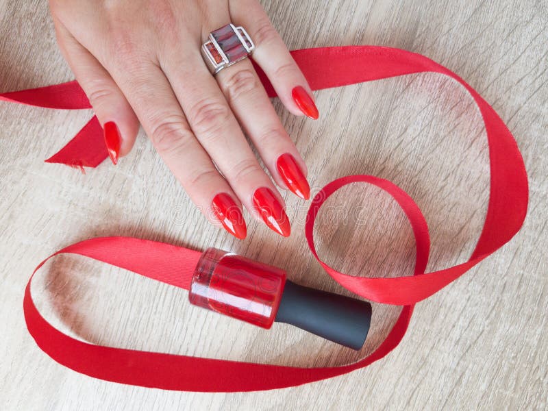 Female Hand With Red Long Nails And A Bottle Stock Image Image O