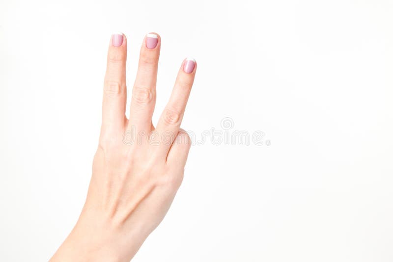 Closeup view of female hand showing three fingers isolated on white background. Fingernails with beautiful french pink manicure. Horizontal color photography