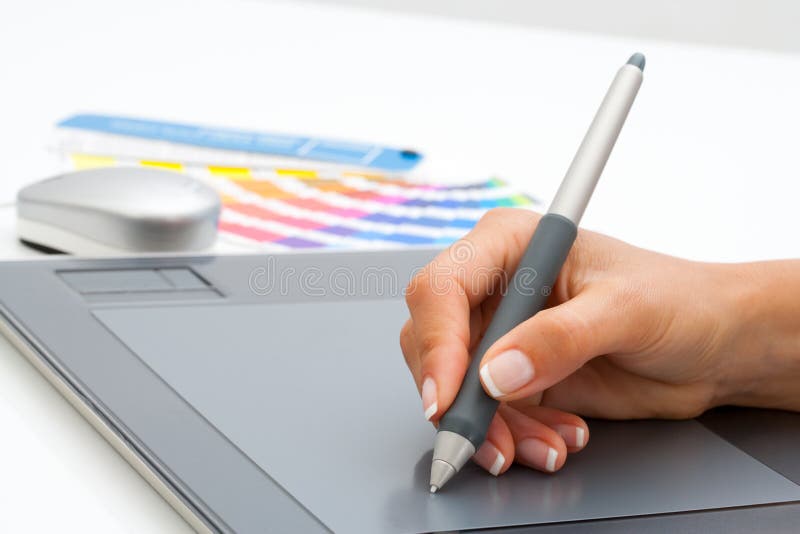 Female hand using pen on digital tablet. stock photography