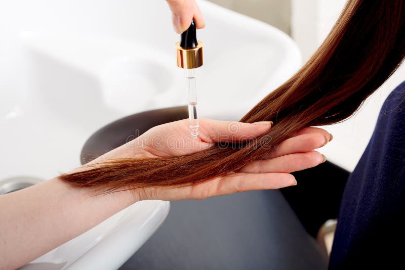 Female Hands Applying Oil on Long Womans Brown Hair. Hair Care Cosmetics,  Bath Beauty Spa Products Stock Photo - Image of facial, beauty: 184341950