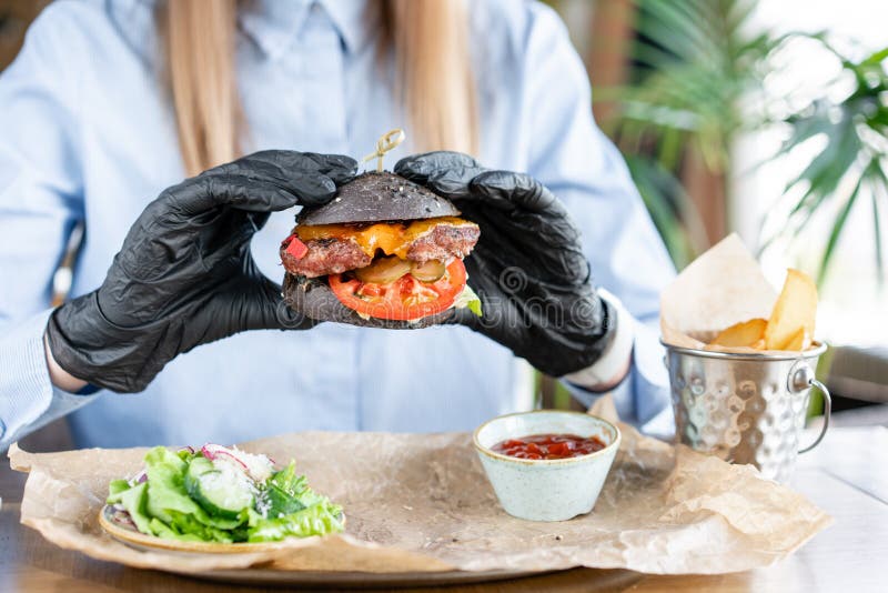Female Hands In Black Gloves Holding Fresh Delicious ...