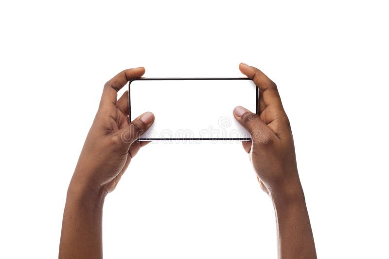 Female hands holding smartphone with blank screen, playing video games stock photos
