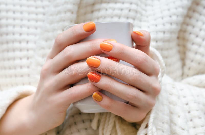 Embrace the Warmth with Radiant Summer Nails : Gold Chrome Swirl Orange Tips