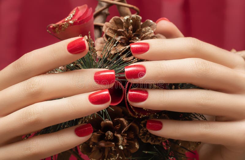 Female Hands with Red Nail Design. Glitter Red Nail Polish Manicure ...