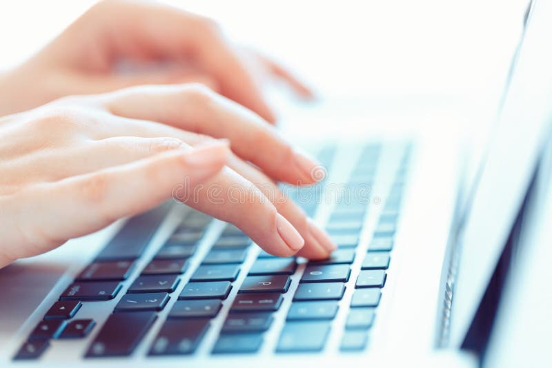 Female hands typing on the keyboard