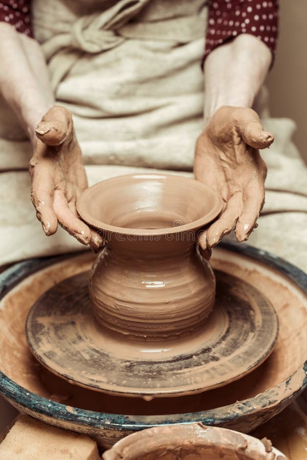 Potters hands on wheel stock image. Image of dishware 11939317