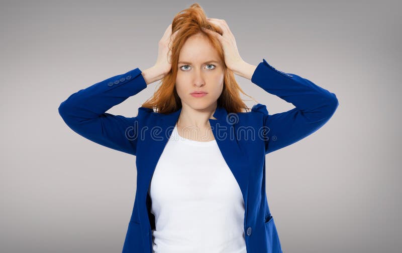 Female headache isolated on gray background - suffering business woman, hard work in company royalty free stock photography Female headache isolated on gray background - suffering business woman, hard work in company royalty free stock photography