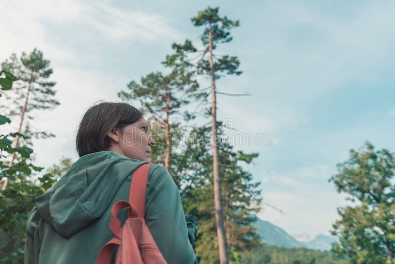Female hiker walking outdoors in woods royalty free stock photo Female hiker walking outdoors in woods royalty free stock photo