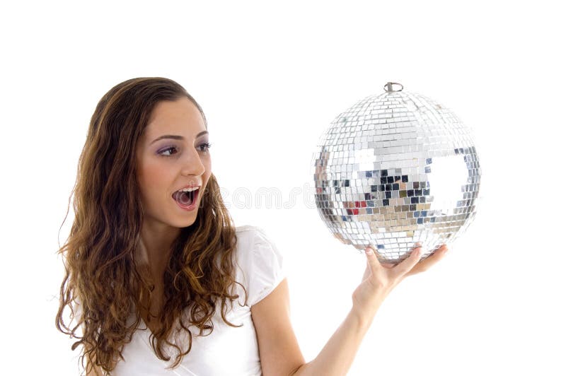 Female holding mirror ball with one hand