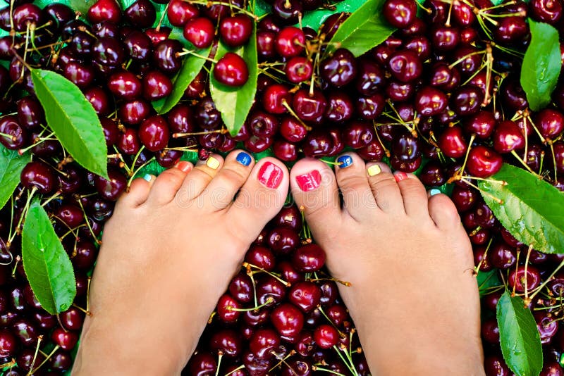 Female legs fresh summer berries