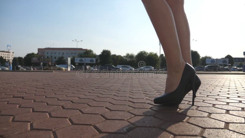 Female Legs in High Heels Shoes Walking in the Urban Street. Feet of ...