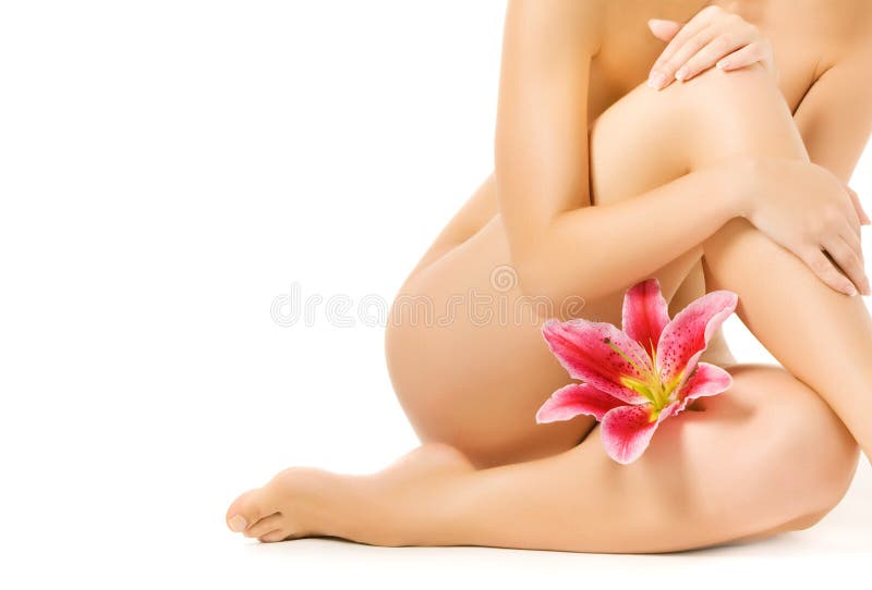 Female legs with pink lily royalty free stock photos