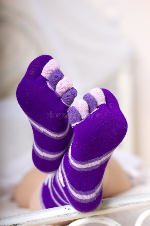 Female legs in purple socks