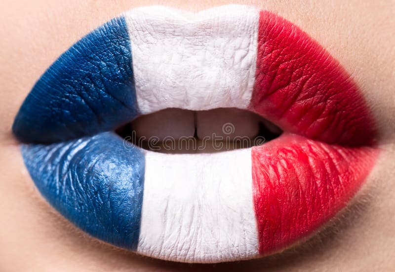 Female lips close up with a picture flag of France. Blue, white, red.