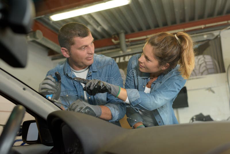 Female male mechanic at workshop. Autorepair