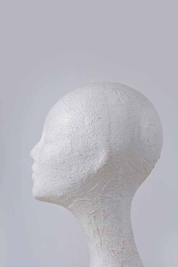 Female mannequin head cork in profile on gray background stock photography Female mannequin head cork in profile on gray background stock photography