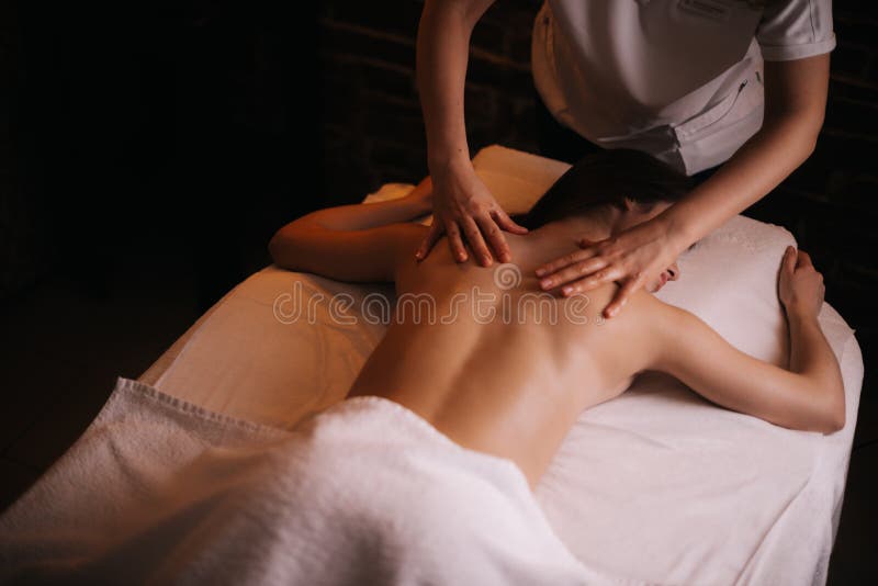 Female Back Massage - Vertical Stock Photo - Image of brunette