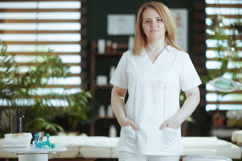 Female Medical Massage Therapist In Spa Salon Looking At Camera Stock Image Image Of Doctor