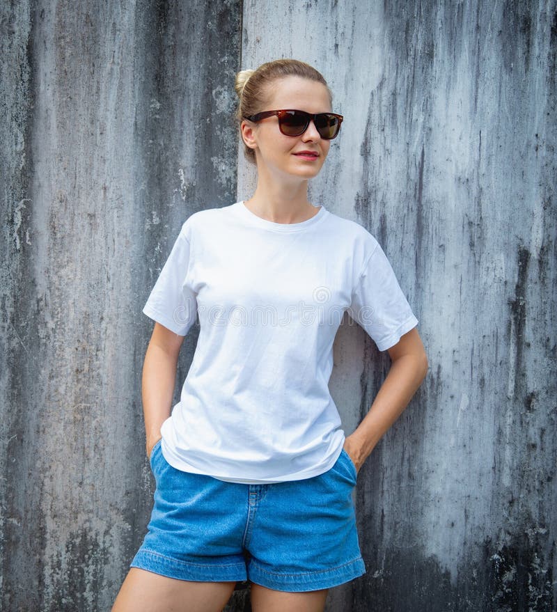 Female Model Wearing White Blank T-shirt on the Background of an Gray ...