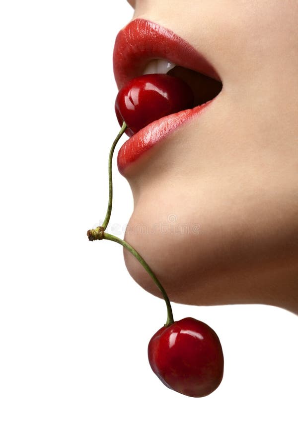 Female mouth with cherries