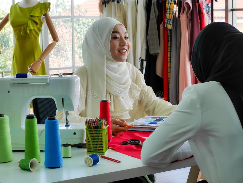 Female Muslim Fashion Designers Wearing HIJAB Working on Dress Stylist ...