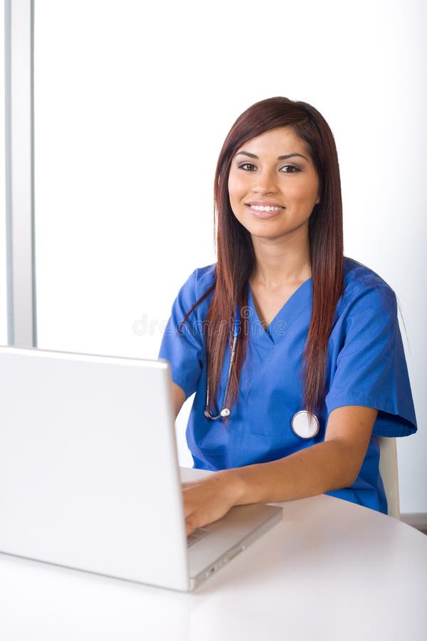 Female nurse at a desk stock photo. Image of hospital 9616822