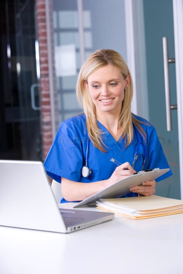 Female nurse at a desk working