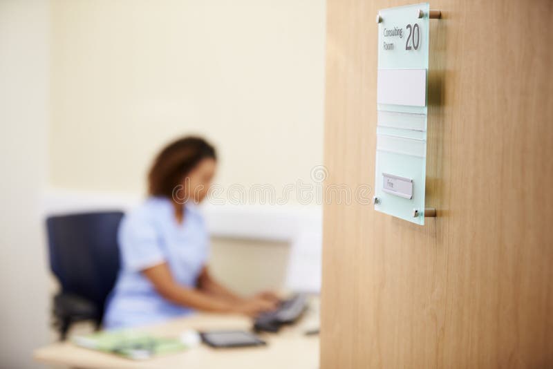 Female Nurse Working at Desk in Office Stock Image Image of office