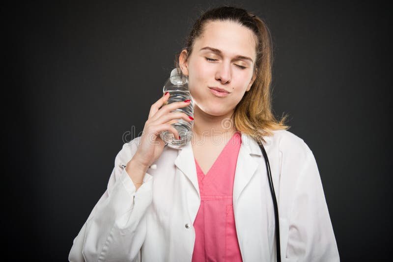 Lady Doctor With Hot Water Bottle Stock Photo Image Of Relieve