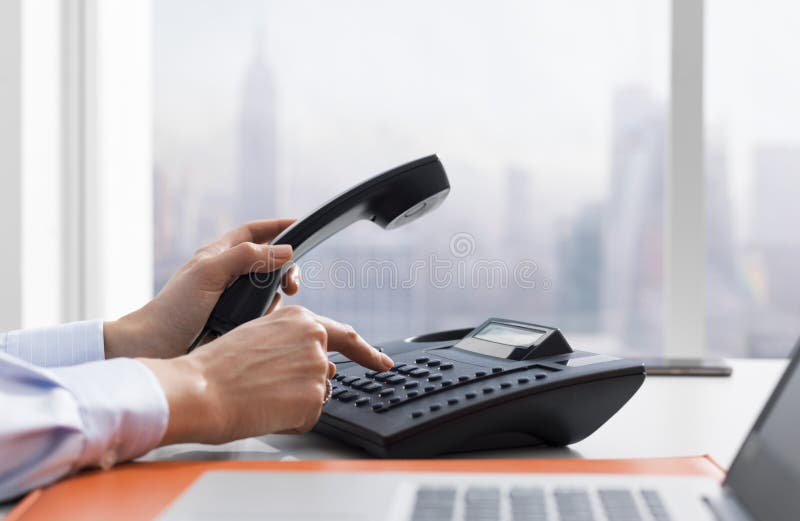 Female office worker making a phone call