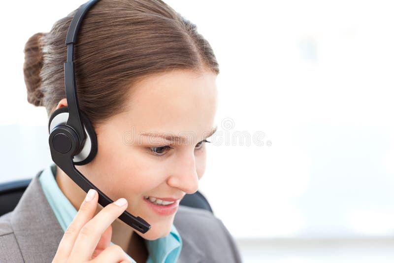 Female operator on the phone with earpiece