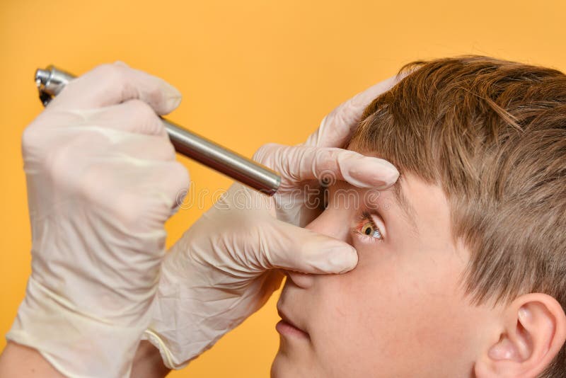 female-ophthalmologist-doctor-examines-boy-s-eye-diagnostic-medical-flashlight-179439535.jpg