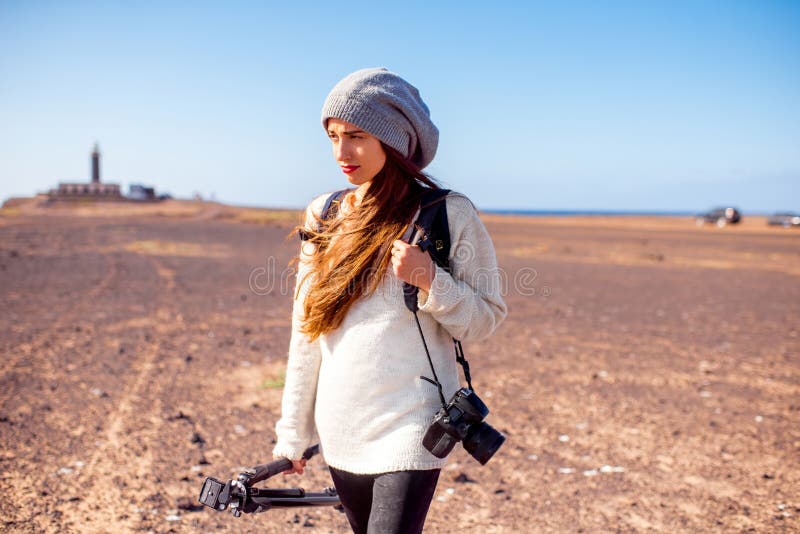 Female photographer walking outdoors stock image Female photographer walking outdoors stock image