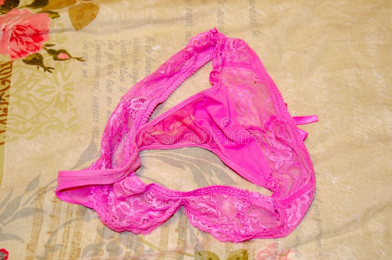 Female, Pink, Used Panties String on the Bed. Fetish. Stock Photo - Image  of lady, pink: 127079354