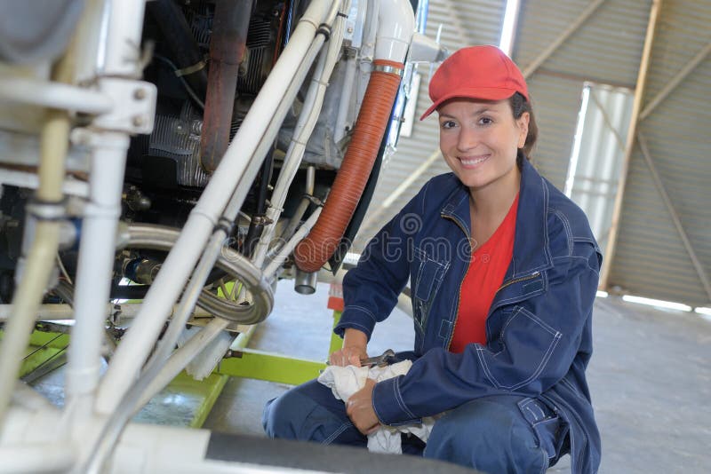 Female plumber working on factory central heating boiler royalty free stock photography Female plumber working on factory central heating boiler royalty free stock photography