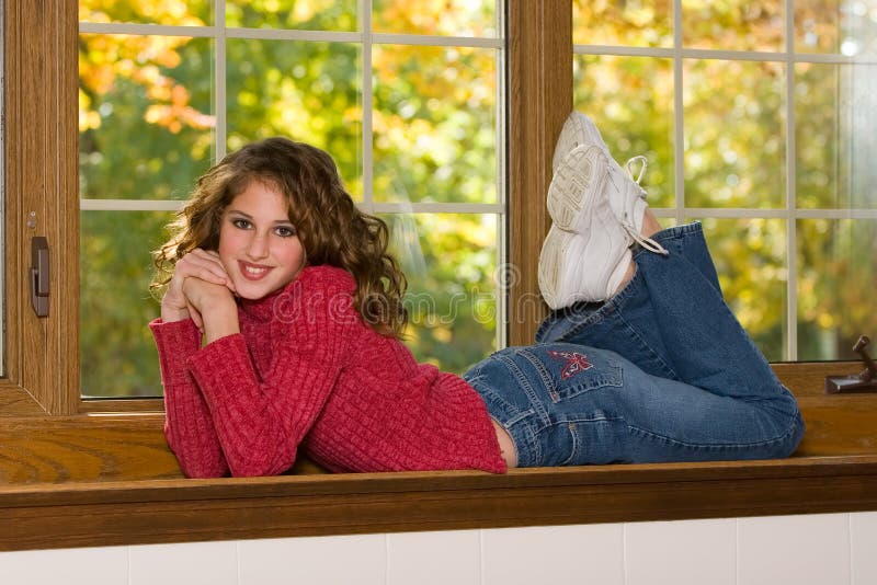 Female Portrait Lying In Window Sill