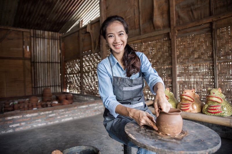 Female potter making pot stock image. Image of business - 81354027