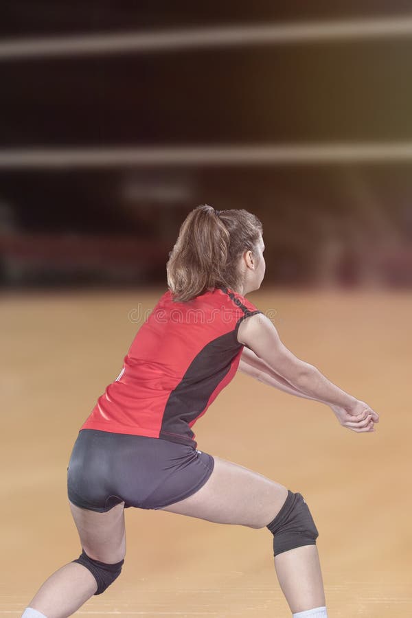 Female Volleyball Players Jumping Closeup on Vollayball Court. Stock