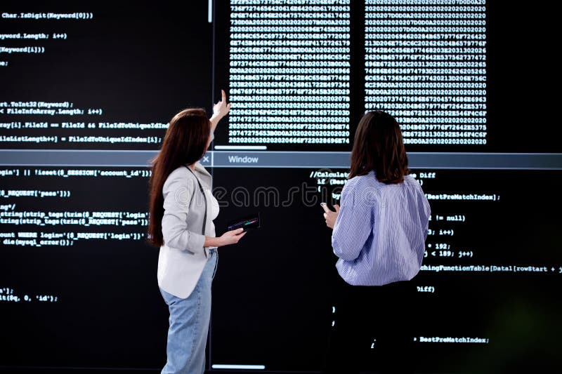 Female Programmer Analyzing Code on Laptop royalty free stock images
