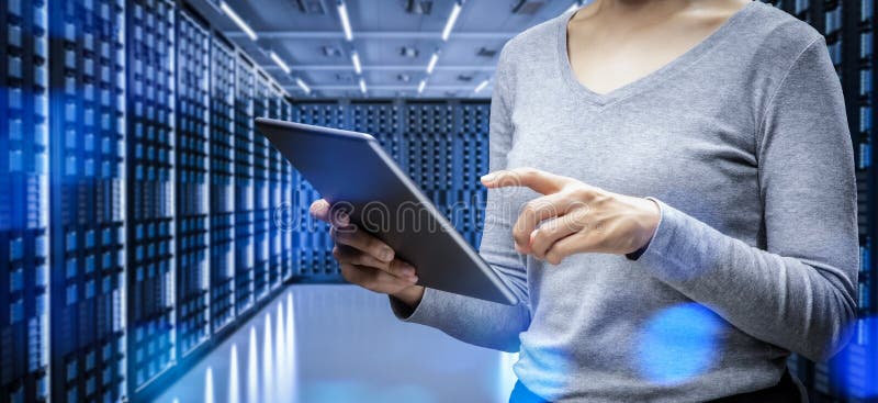 Female programmer in server room stock photography