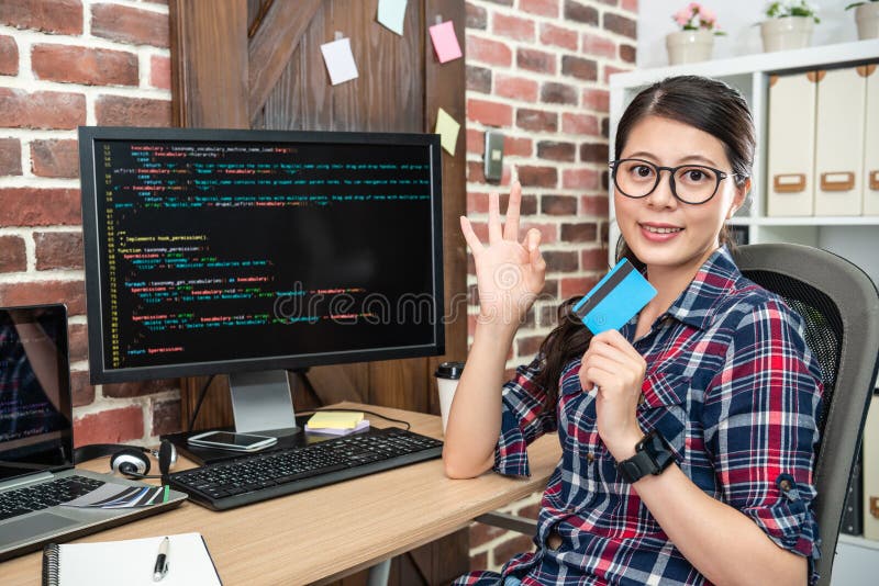 Female programmer showing an ok gesture stock photography