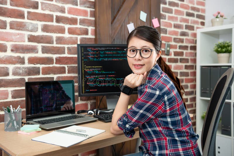 Female programmer sitting in working office stock photos